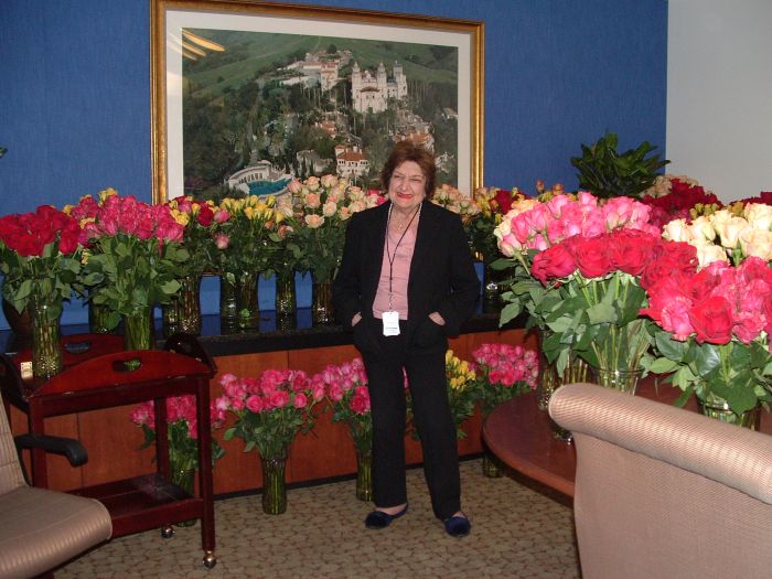 Helen Thomas, surrounded by a rich and fragrant reward